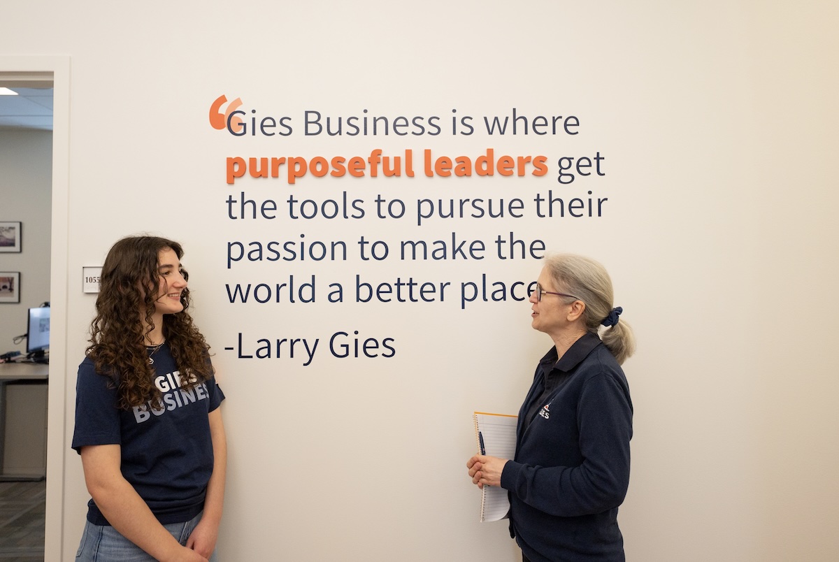 A student and advisor chatting inside of BIF