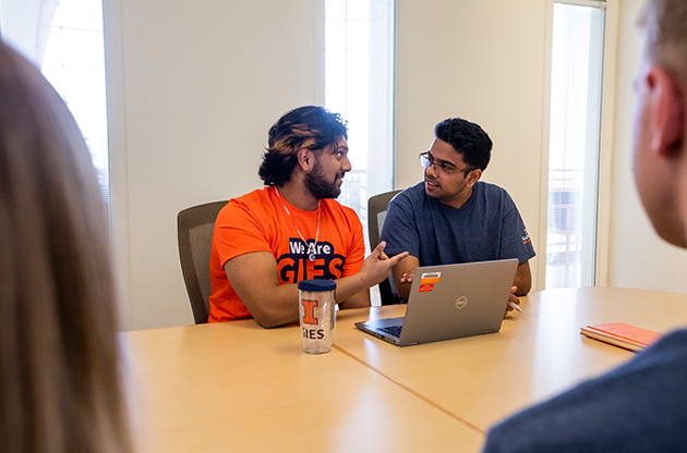 students discussing over laptop in BIF conference room students discussing over laptop in BIF conference room